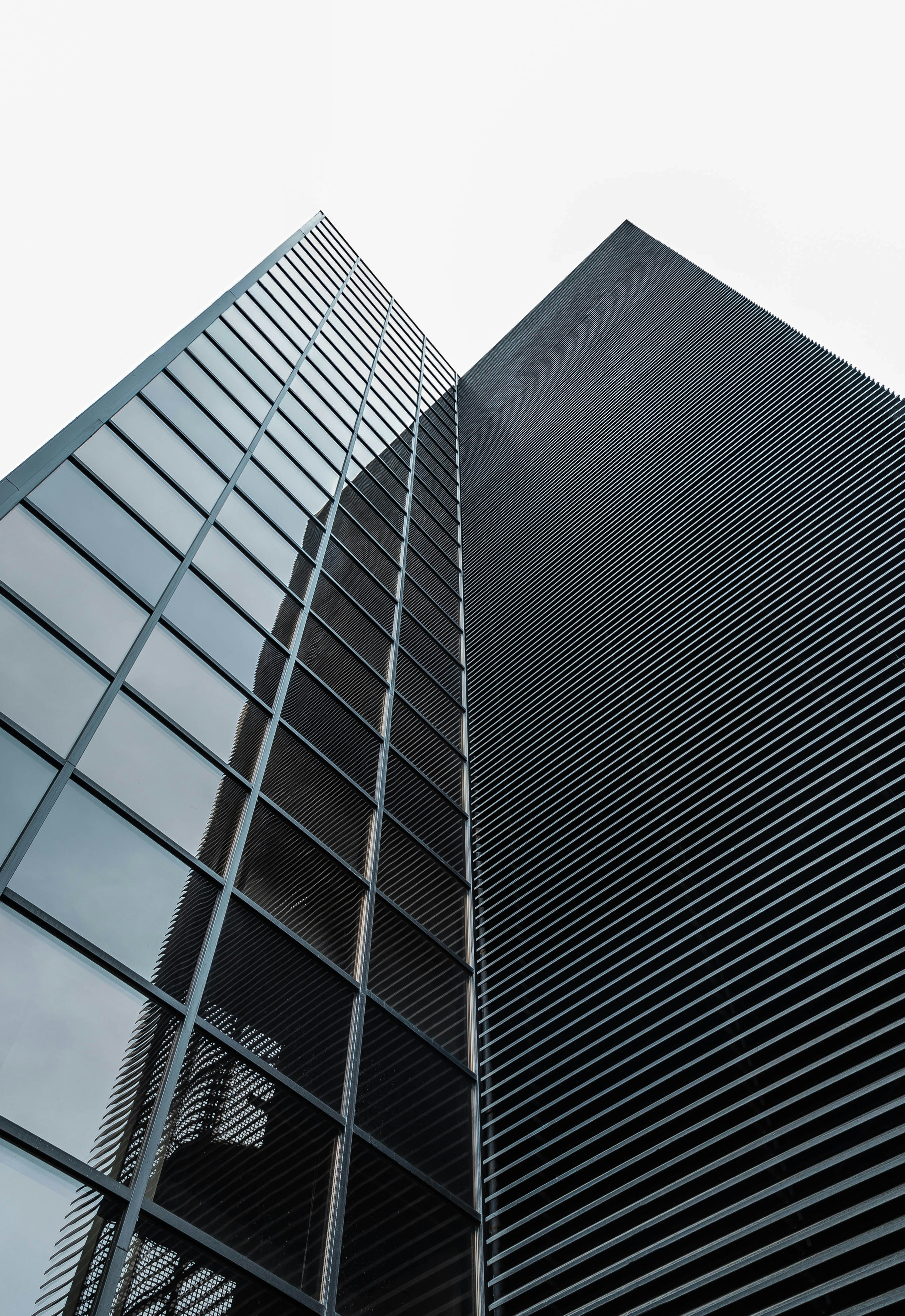 low angle photography of black glass building